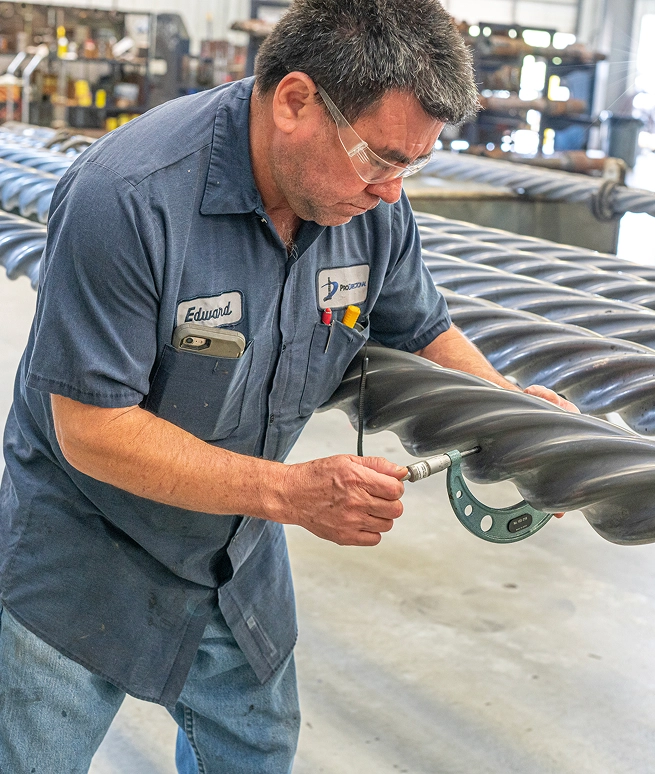 ProDirectional Texas drilling engineer measuring downhole motor components in-house