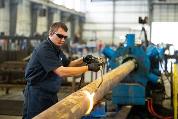 ProDirectional technician performing precision pipe repair to prevent non productive time and ensure drilling tool reliability